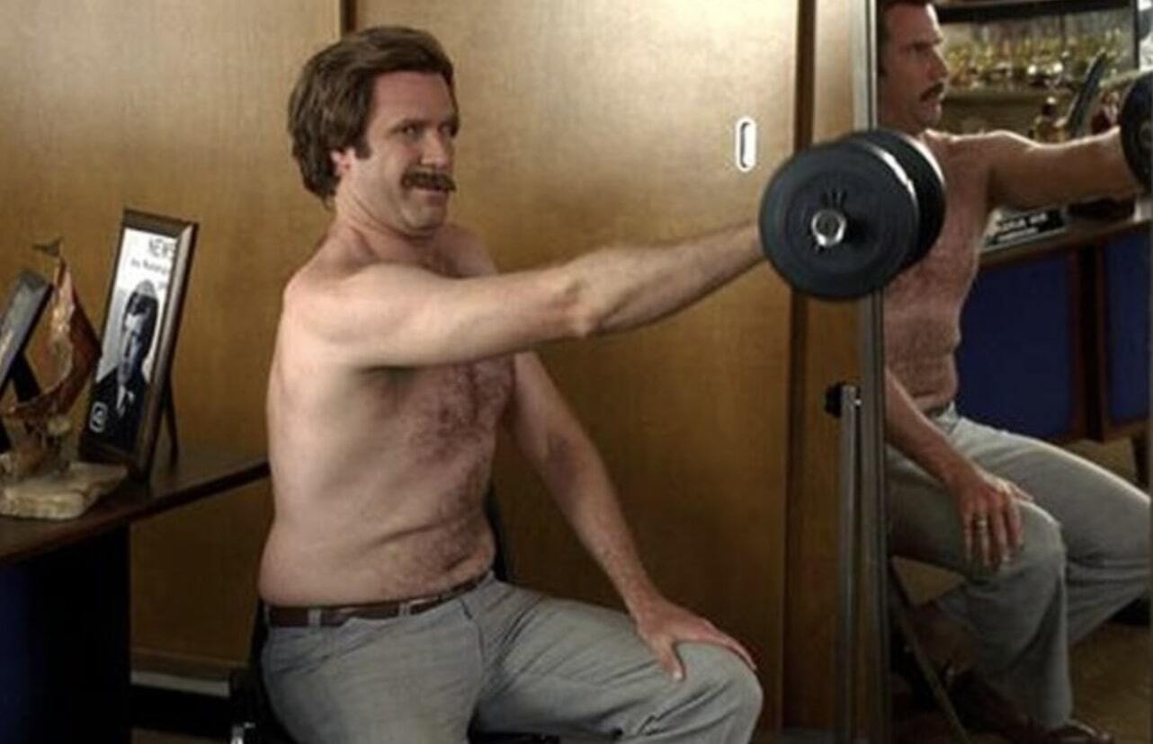 Ron Burgundy lifting weights shirtless