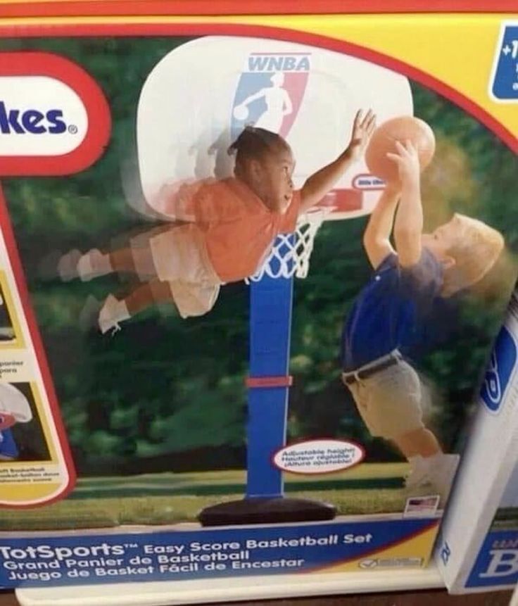 A kid blocking another kid's shot