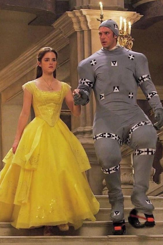 Guy in CGI outfit walking with Belle while filming the live action Beauty and the Beast movie