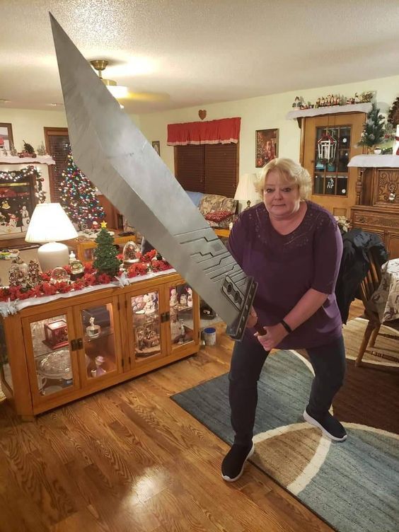 A lady holding a really big sword
