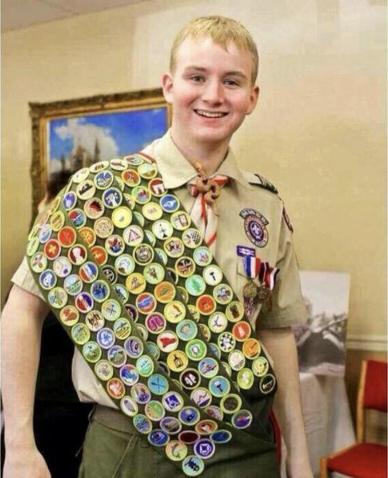 A boyscout with lots of merit badges.