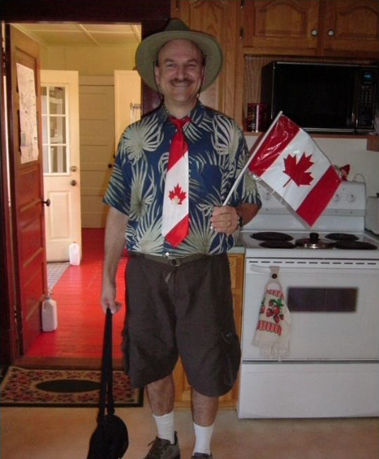Canada guy in a maple-leaf shirt gesturing with both hands