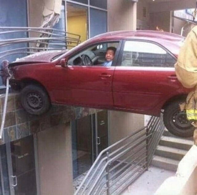 A car stuck in the middle of some stairs