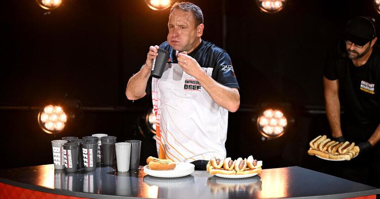 Joey Chestnut eating hot dogs