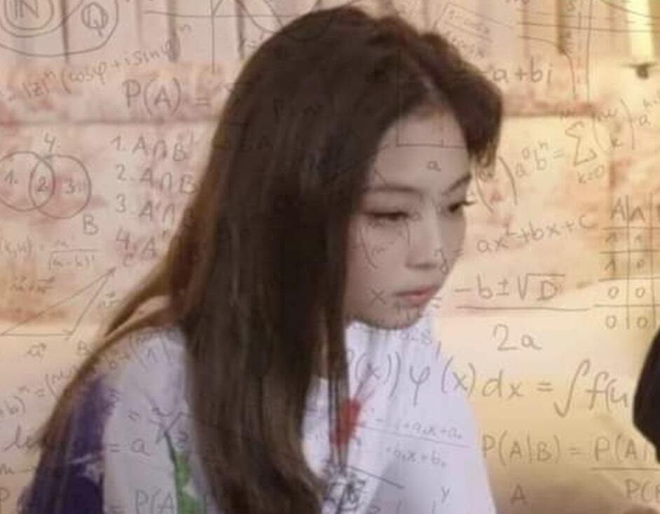 Sad looking woman with equations written all around her
