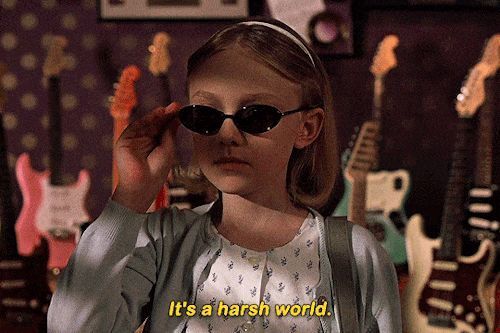 Little girl with sunglasses saying, it's a harsh world