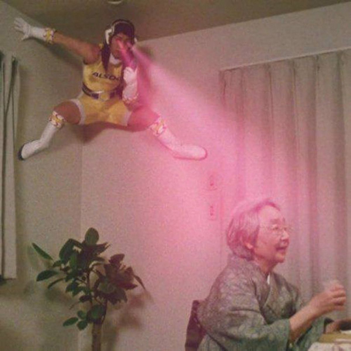 A girl hiding in the corner scanning an old lady's face