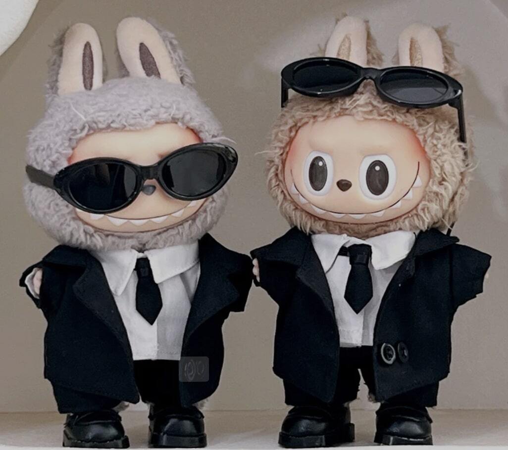 Two labubus dressed in suits and ties