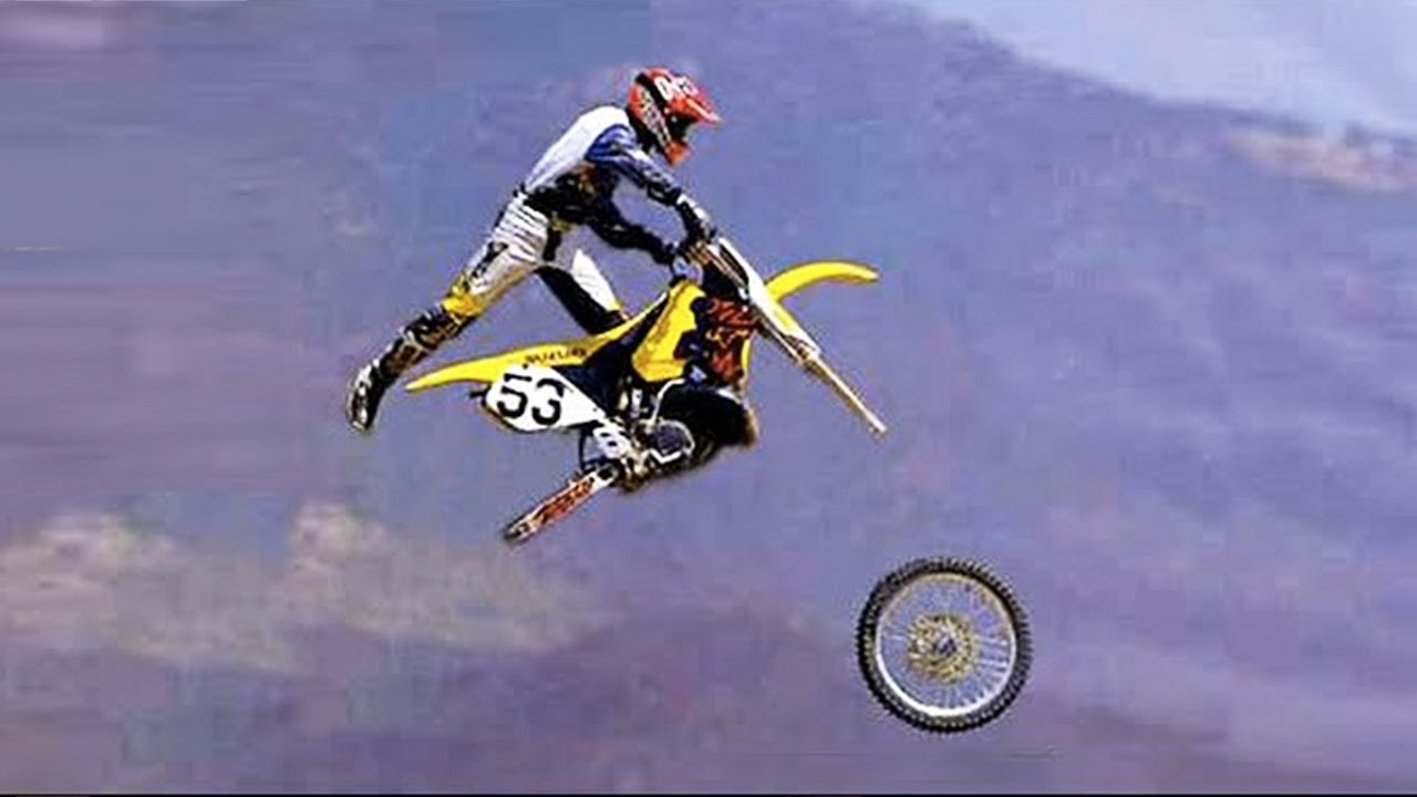 Guy on motorcross bike with wheels falling off