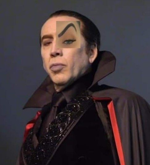 Nicolas Cage as a vampire with a raised eyebrow