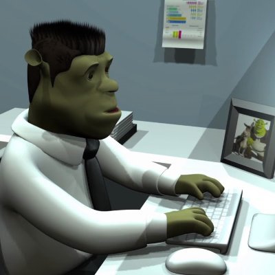 Shrek working at a computer