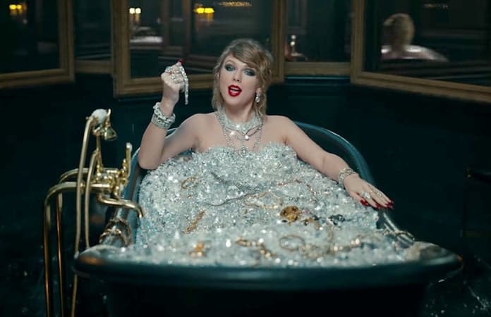 Taylor Swift in a bathtub of diamonds