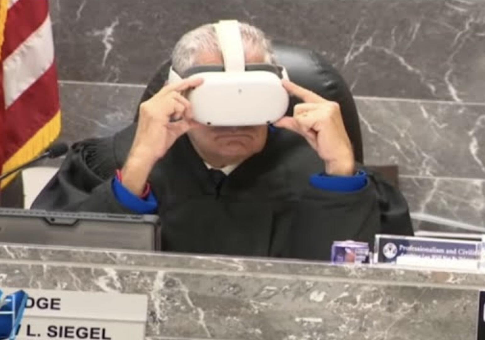 A judge wearing a VR headset