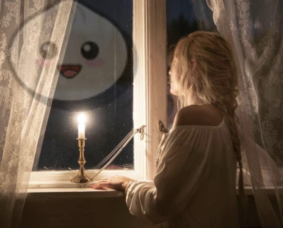 A woman staring out her window with a candle