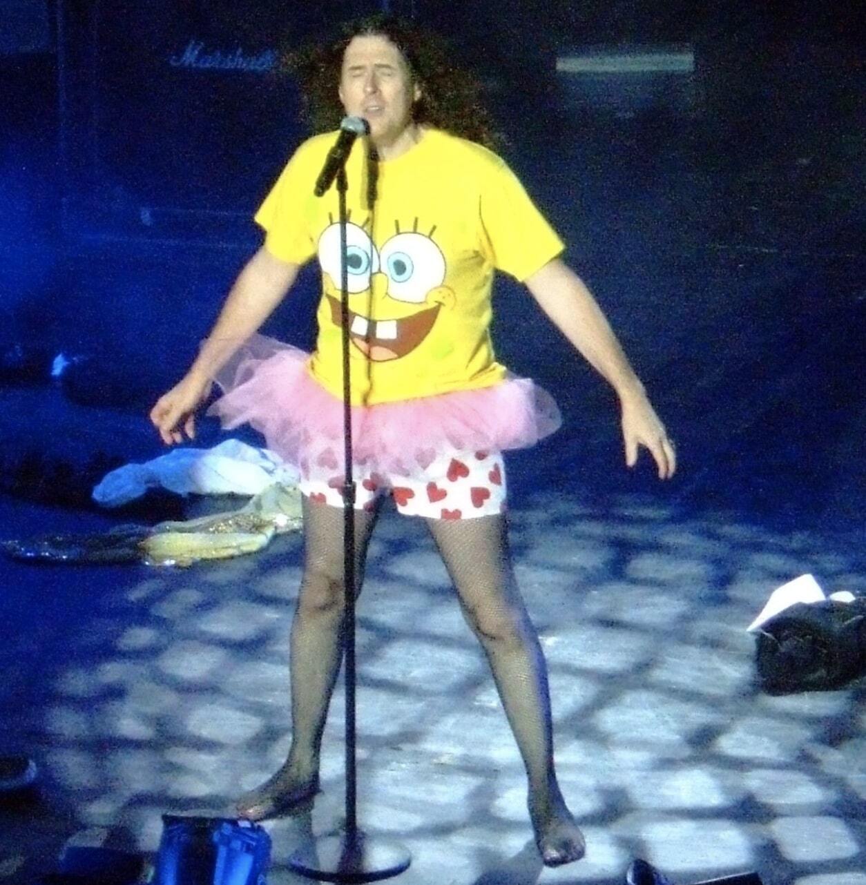 Weird Al performing in a Spongebob t-shirt and a tutu