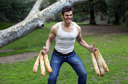 Guy dressed as wolverine with baguettes as claws