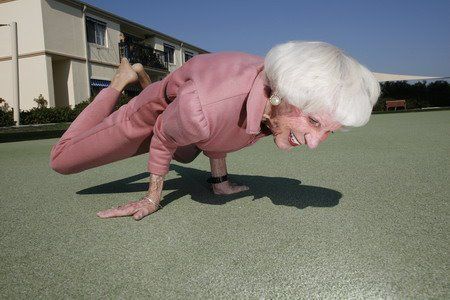 An old lady doing a yoga pose
