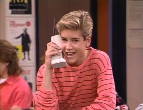 Zack Morris from Saved by the Bell talking on an old phone